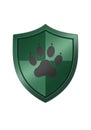 A green shield emblem with a glossy finish featuring a black paw print at its center. Royalty Free Stock Photo