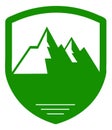 Green shield with mountain landscape. Nature badge