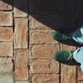 Green shoes on the bricks