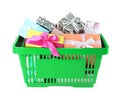 Green shopping basket with gifts on white background Royalty Free Stock Photo