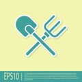 Green Shovel and rake icon isolated on yellow background. Tool for horticulture, agriculture, gardening, farming. Ground