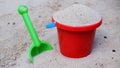 Sand toys with shovel and bucket in a sandpit Royalty Free Stock Photo