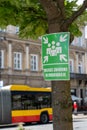 A green sign indicating the collection point for the evacuation in Warsaw. A sign for a meeting point in case of a