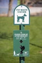 Green sign saying 'pet waste station'