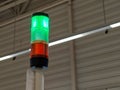 Green signal light on with red light off at store checkout in retail context for operational status indication alert system