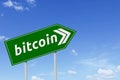 Green signpost with bitcoin word