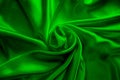 Green silk delicate fabric twisted and folded in drapery