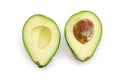 Green avocado fruit cut in half on a white background