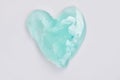 Green slime for kids in a heart shape,