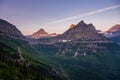 Green Slopes Below Rugged Mountains at Logan Pass