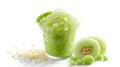 Green slush in a cup with tapioca pearls, next to sliced honeydew and melon balls