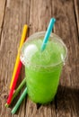 Green Slushie Drink in Plastic Cup with Straws Royalty Free Stock Photo