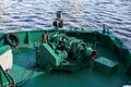Green small anchor winch on bunker barge. Bow of bunker barge Royalty Free Stock Photo