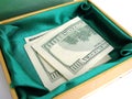 Green small box with one hundred dollar bill sticking Royalty Free Stock Photo