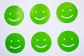 The green smilies on a white background.