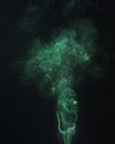 Green smoke on a black backround