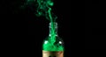 Green Smoke Emitting from a Glass Bottle on Black Background Royalty Free Stock Photo