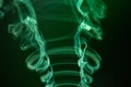 Green smoke trails swirling on the black background Royalty Free Stock Photo