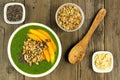 Green smoothie bowl overhead scene on wood Royalty Free Stock Photo