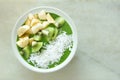 Green smoothie bowl on a white marble background Royalty Free Stock Photo