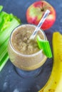 Green smoothie with celery, banana and apple
