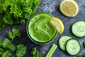 Green smoothie with celery, cucumber and lemon