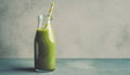 Green smoothie in glass bottle with paper straw. Tasty and healthy drink