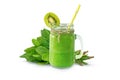 Green smoothie in a glass and spinach isolated Royalty Free Stock Photo