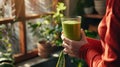 The green smoothie in hand. AI generated Royalty Free Stock Photo
