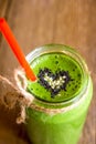 Green smoothie with heart of seeds Royalty Free Stock Photo