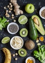 Green smoothie ingredients. Cooking healthy detox smoothies. On a dark background Royalty Free Stock Photo