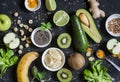 Green smoothie ingredients. Cooking healthy detox smoothies. On a dark background Royalty Free Stock Photo