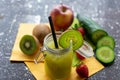 Green smoothie in a jar with crushred ice and kiwi slice. Royalty Free Stock Photo