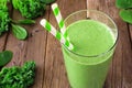 Green smoothie with kale and spinach, close up on a wood background Royalty Free Stock Photo