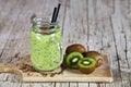 Green smoothie with kiwi, apple, lemon and linen seeds. Healthy fresh diet eating, superfood
