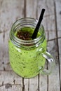 Green smoothie with kiwi, apple, lime and linen seeds. Healthy fresh diet eating, superfood