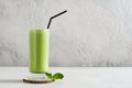 Green smoothie mint or matcha latte in tall glass Royalty Free Stock Photo