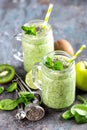 Green smoothie with spinach, apple, kiwi, lime and chia seeds