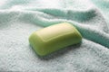 Green soap on towel background, close up Royalty Free Stock Photo