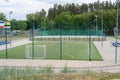 Green soccer field with blue seats. Sports stadium Royalty Free Stock Photo