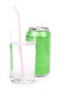Green soda can and glass