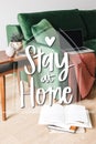 Green sofa, blanket and laptop near Royalty Free Stock Photo