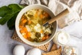 Green sorrel and egg soup, Russian egg drop soup. Served with sour cream. Royalty Free Stock Photo