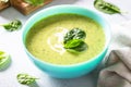 Green soup. Spinach cream soup with cream. Royalty Free Stock Photo