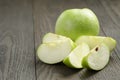 Green sour apple on wood table sliced Royalty Free Stock Photo