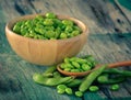 Green soy beans in the wood bowl on table Royalty Free Stock Photo