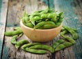 Green soy beans in the wood bowl on table Royalty Free Stock Photo