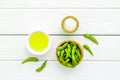 Green soybeans or edamame and oil for fresh healthy food on white wooden background top view Royalty Free Stock Photo