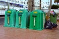 Green Spanish garbage recycle containers.