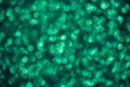Green sparkly bokeh background. Shiny texture. New Year background